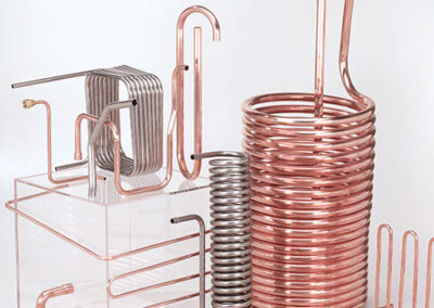 Many different copper pipes arranged in a coil or in a grid made by Spinco Metal Products Inc in Newark, NY