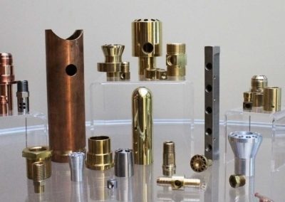 A collection of different pipes, nozzles, and rings of copper made by Spinco Metal Products Inc in newark, NY